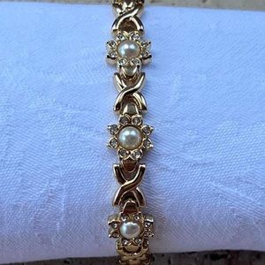 Gold toned unbranded bracelet with pearl and crystal detailing.